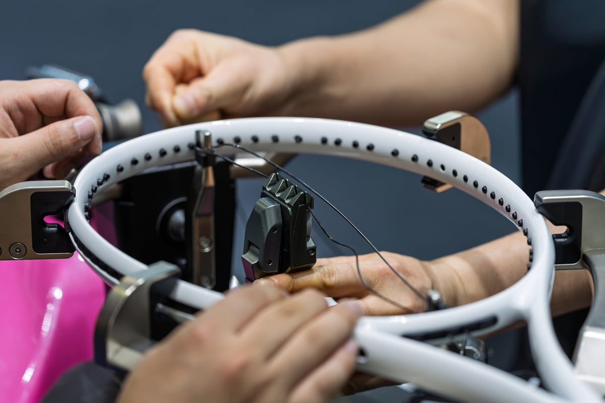 Professional stringing work being performed on a tennis racket
